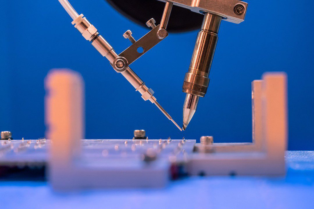 Pogo pin manufacturing on a blue background