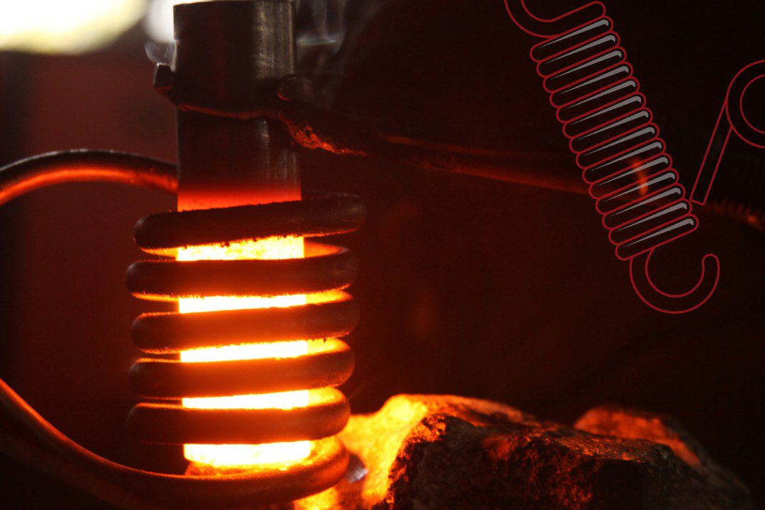 Manufactured spring being heated