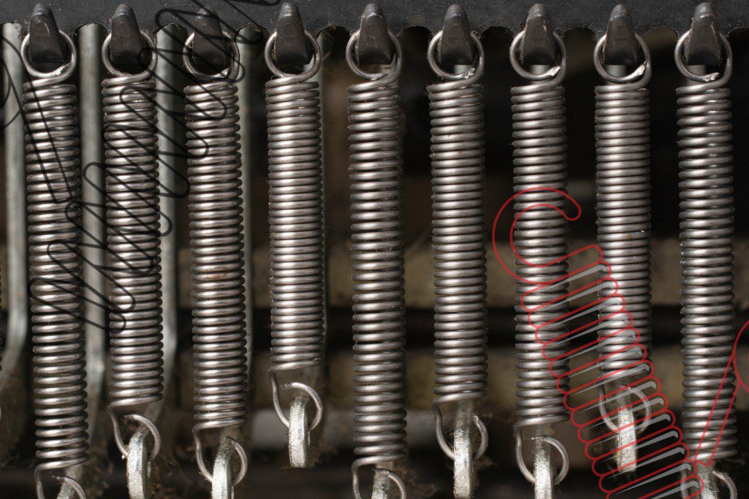 Steel springs on a gray background